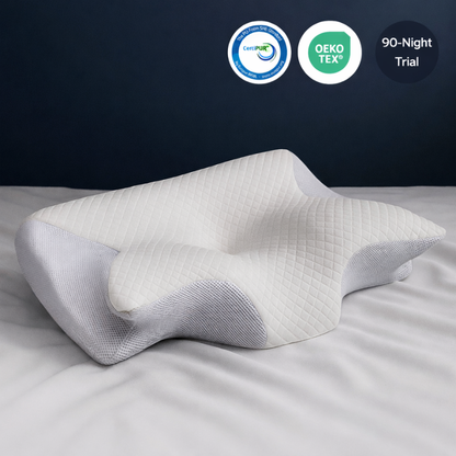 Ergonomic pillow on a bed with CertiPUR and OEKO-TEX logos and a 90-night trial label.